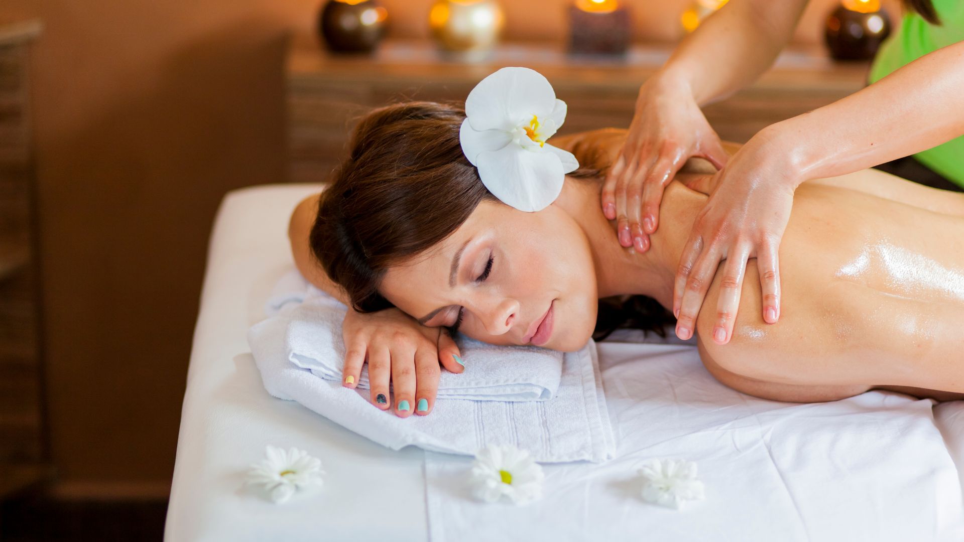 A woman getting a back massage at a spa